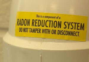 Radon testing warning on a radon mitigation system in Lexington Kentucky